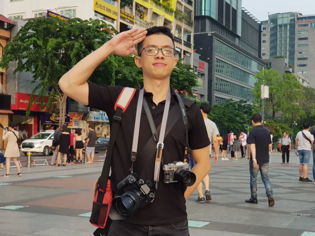 Kha with two cameras on a city street